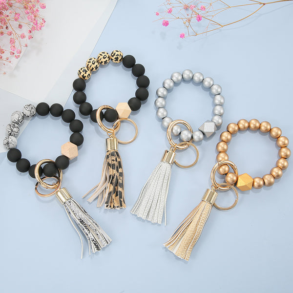Großhandel 1 Stück Mode Quaste PU Leder Perlen Frauen Schlüsselanhänger