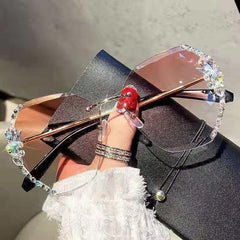 Wholesale Elegant Solid Color PC Oval Frame Rhinestone Frameless Women's Sunglasses - ChicMeto